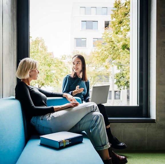 Manager holding wellbeing conversation with a member of their team.