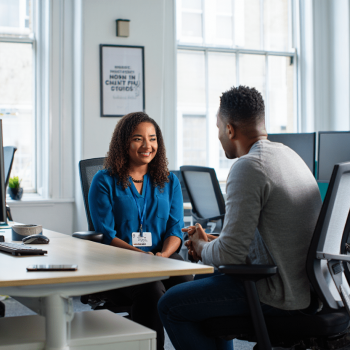 A wellbeing champion coaches a colleague